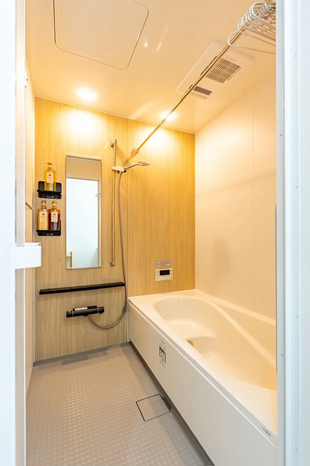 Bathroom with a bathtub and separate shower space