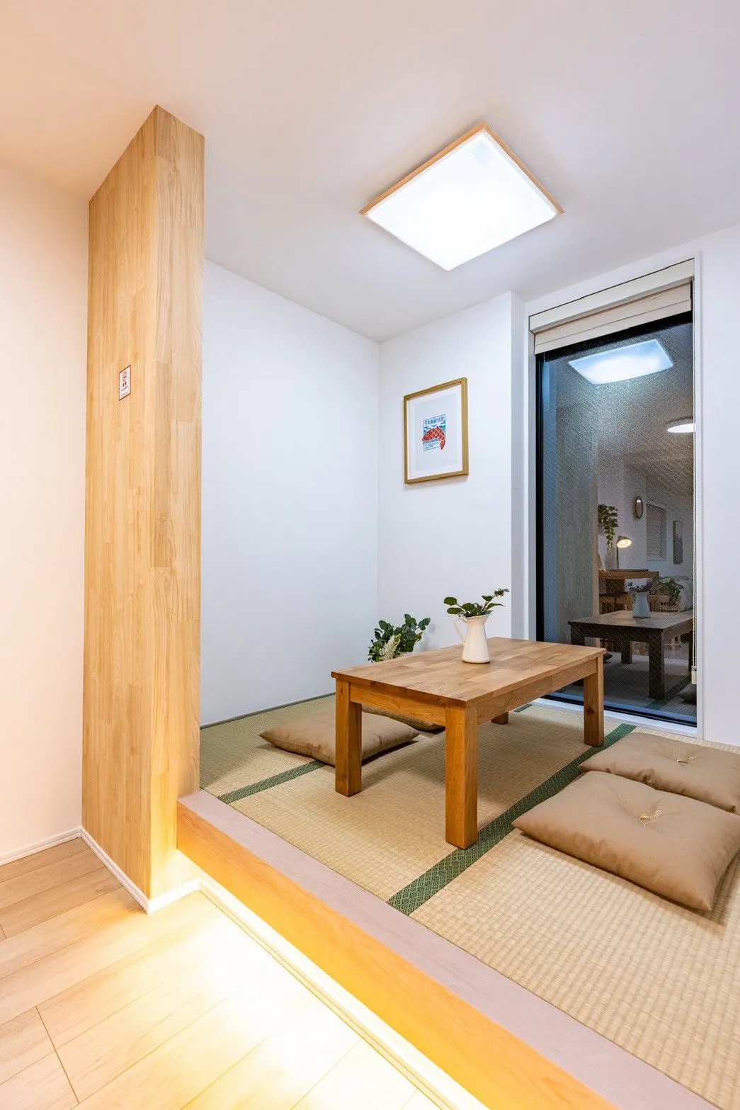 Tatami sitting corner with a low wooden table and floor cushions